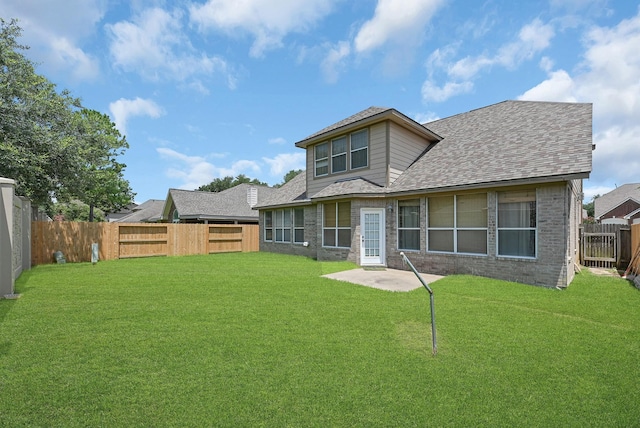 5542 Morgan Park Ln, Sugar Land, TX 77479 - rear view of property with a lawn, brick siding, a shingled roof, and a fenced backyard