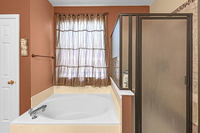5542 Morgan Park Ln, Sugar Land, TX 77479 - full bathroom with a shower stall and a garden tub