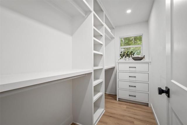 spacious closet with light wood-style floors