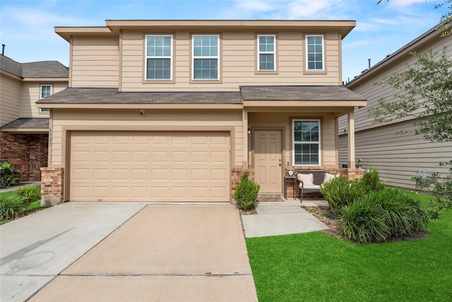 view of front facade featuring an attached garage, a front lawn, roof with shingles, and concrete driveway