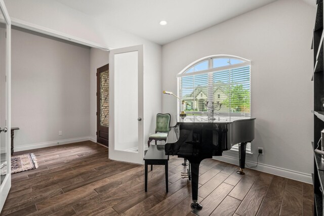 living area with baseboards, french doors, recessed lighting, and wood finished floors