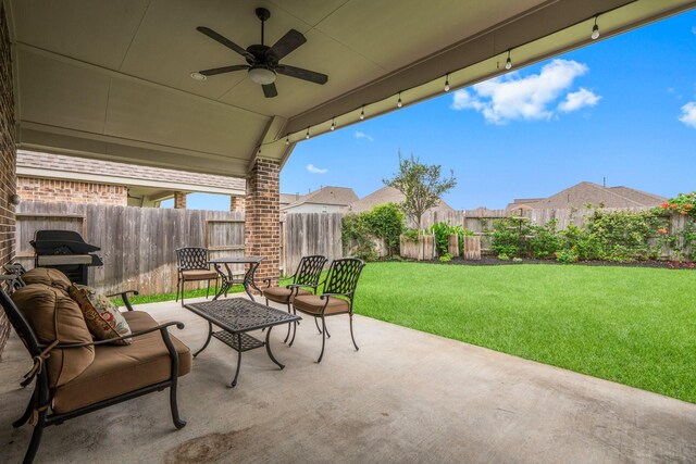 view of patio featuring a ceiling fan, a fenced backyard, and a grill