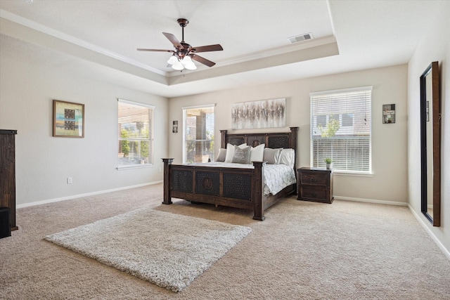 2411 Lakeway Dr, Friendswood, TX 77546 - bedroom featuring visible vents, crown molding, baseboards, a raised ceiling, and carpet
