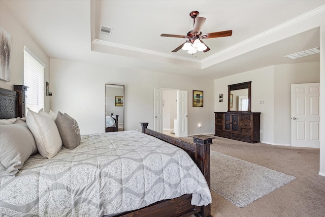2411 Lakeway Dr, Friendswood, TX 77546 - bedroom with visible vents, carpet, crown molding, and a tray ceiling