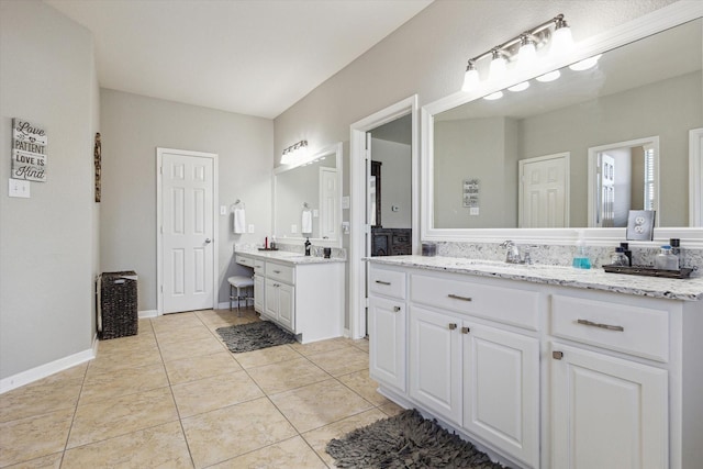2411 Lakeway Dr, Friendswood, TX 77546 - full bathroom featuring two vanities, a sink, and tile patterned flooring