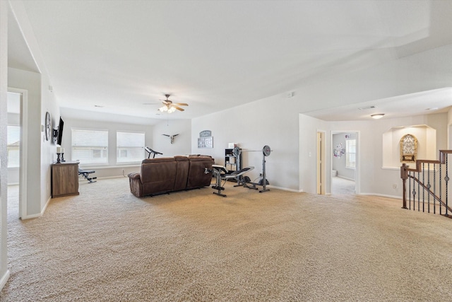 2411 Lakeway Dr, Friendswood, TX 77546 - carpeted living area with baseboards and a ceiling fan