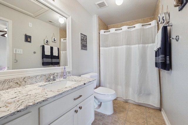 2411 Lakeway Dr, Friendswood, TX 77546 - full bathroom with toilet, visible vents, tile patterned flooring, and vanity