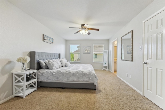 2411 Lakeway Dr, Friendswood, TX 77546 - bedroom featuring baseboards, a ceiling fan, and light colored carpet