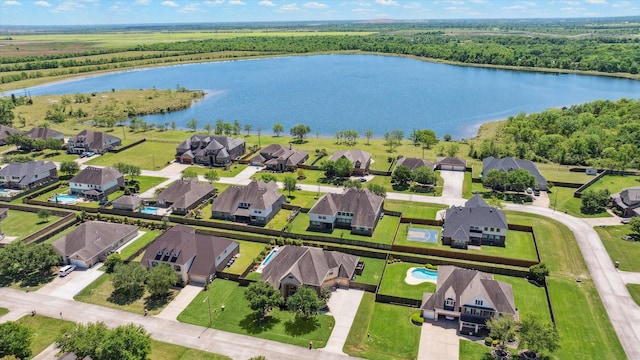 2411 Lakeway Dr, Friendswood, TX 77546 - birds eye view of property with a water view, a residential view, and a forest view