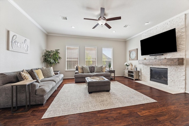 2411 Lakeway Dr, Friendswood, TX 77546 - living area with crown molding, ceiling fan, a fireplace, and visible vents