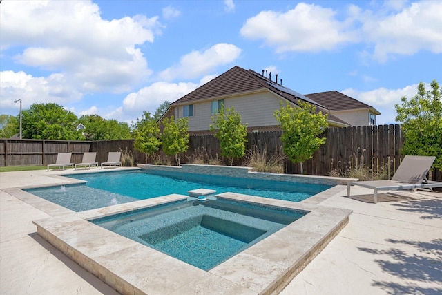 2411 Lakeway Dr, Friendswood, TX 77546 - view of swimming pool featuring a patio, a fenced backyard, and a pool with connected hot tub