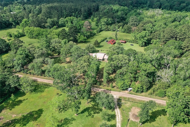 bird's eye view featuring a wooded view