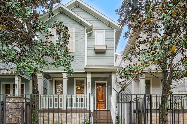 1224 Nelson Falls Ln, Houston, TX 77008 - view of front of home featuring a gate, covered porch, and a fenced front yard