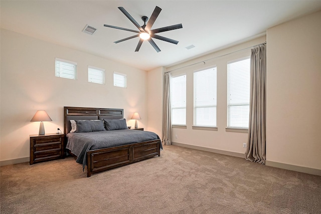 bedroom featuring visible vents, carpet flooring, and baseboards