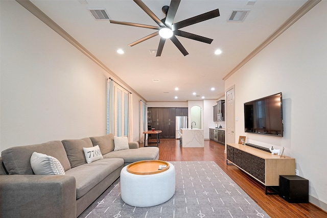 1224 Nelson Falls Ln, Houston, TX 77008 - living room featuring ornamental molding, wood finished floors, a ceiling fan, recessed lighting, and baseboards