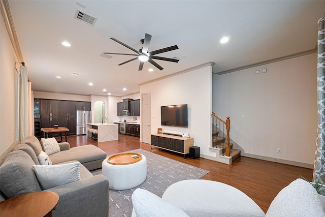 1224 Nelson Falls Ln, Houston, TX 77008 - living area featuring wood finished floors, ceiling fan, recessed lighting, stairway, and baseboards