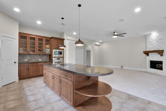 73 La Jolla Cir, Montgomery, TX 77356 - kitchen with open shelves, a kitchen island, dark countertops, and stainless steel appliances