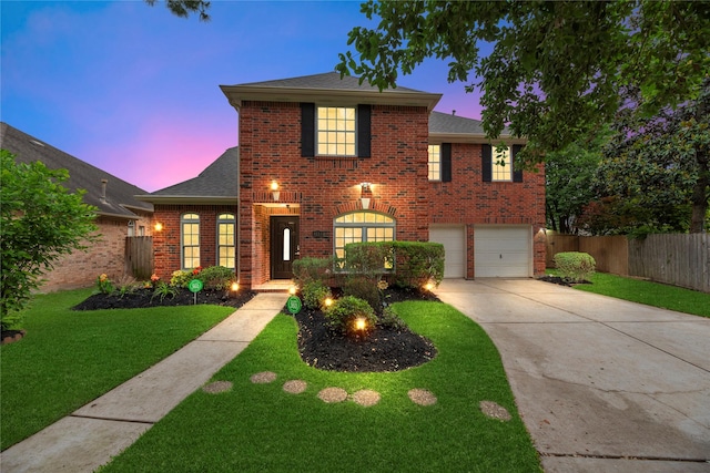 4614 Ringrose Dr, Missouri City, TX 77459 - traditional home featuring fence, an attached garage, brick siding, a lawn, and driveway
