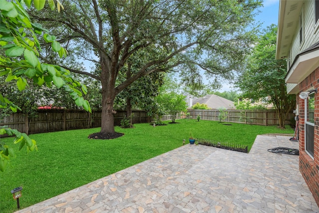 4614 Ringrose Dr, Missouri City, TX 77459 - view of yard with a fenced backyard and a patio area