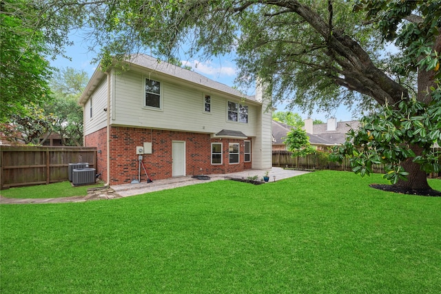 4614 Ringrose Dr, Missouri City, TX 77459 - rear view of property with a yard, brick siding, a patio, and a fenced backyard