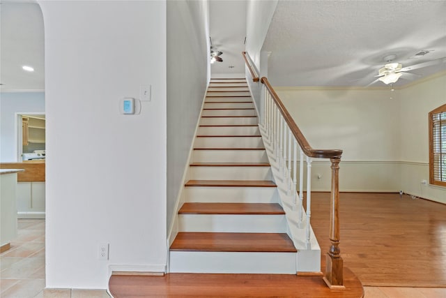 4614 Ringrose Dr, Missouri City, TX 77459 - stairs featuring baseboards, ceiling fan, ornamental molding, and wood finished floors