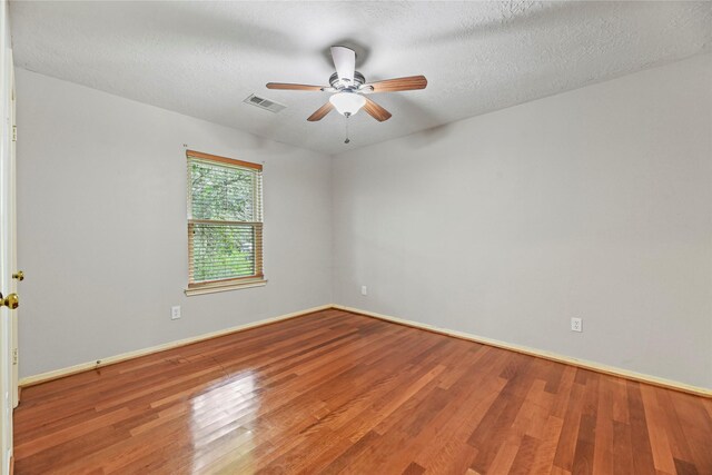 4614 Ringrose Dr, Missouri City, TX 77459 - unfurnished room with visible vents, baseboards, ceiling fan, and wood finished floors