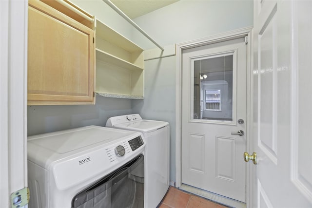 4614 Ringrose Dr, Missouri City, TX 77459 - laundry area with cabinet space, light tile patterned flooring, and independent washer and dryer