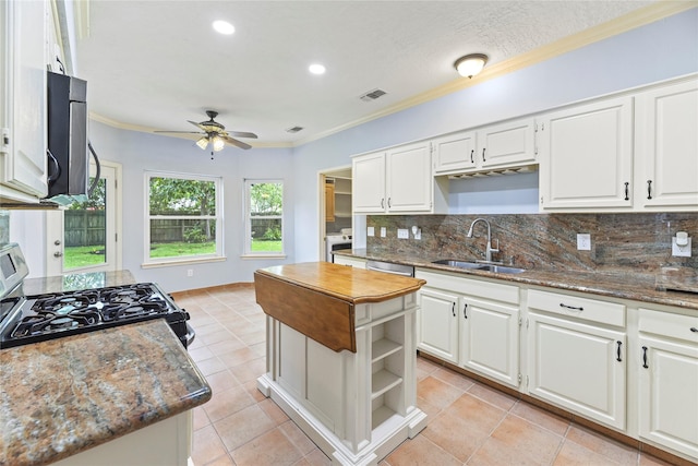 4614 Ringrose Dr, Missouri City, TX 77459 - kitchen with decorative backsplash, a ceiling fan, visible vents, appliances with stainless steel finishes, and a sink