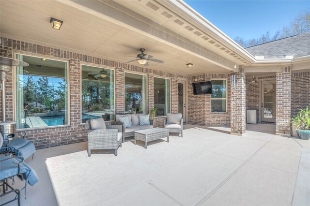 view of patio with a ceiling fan and an outdoor hangout area