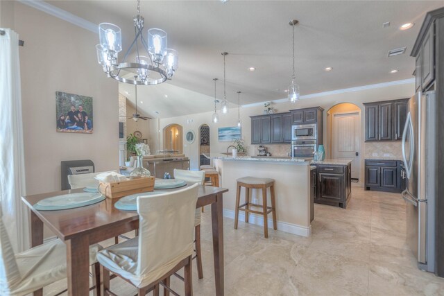 dining space with arched walkways, visible vents, recessed lighting, and a notable chandelier