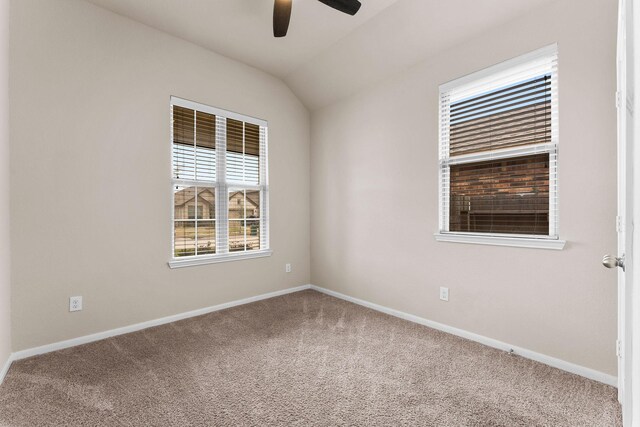 spare room featuring carpet floors, baseboards, and ceiling fan