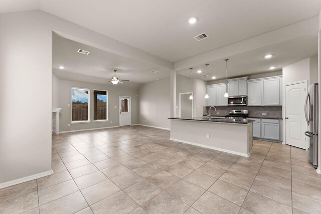 kitchen featuring visible vents, dark countertops, appliances with stainless steel finishes, tasteful backsplash, and recessed lighting