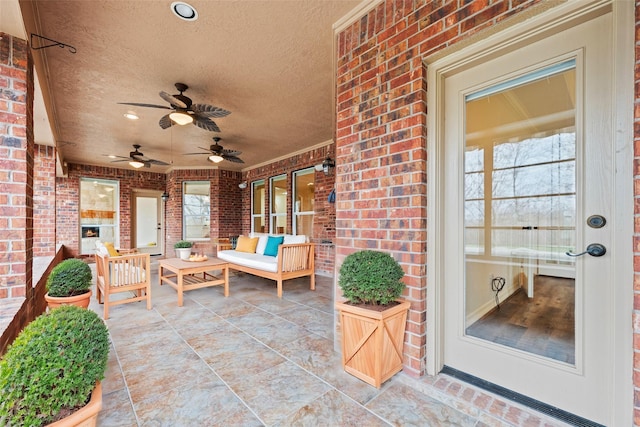 view of patio featuring ceiling fan and outdoor lounge area