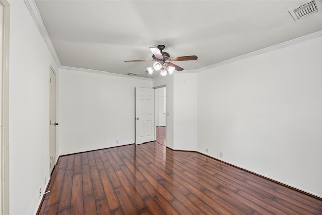 empty room featuring visible vents, crown molding, hardwood / wood-style floors, and ceiling fan