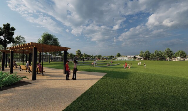 view of community with a yard and a pergola