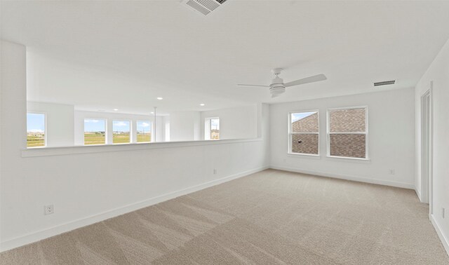 carpeted spare room with a ceiling fan, baseboards, visible vents, and recessed lighting