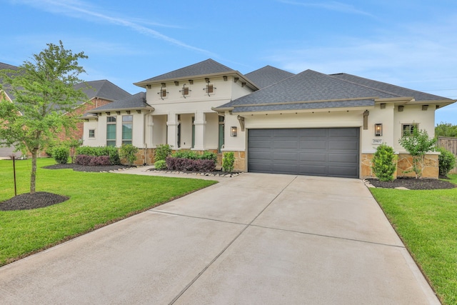 view of front of home featuring a shingled roof, an attached garage, a front lawn, stone siding, and concrete driveway