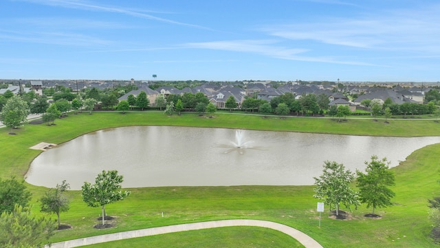 drone / aerial view with a water view and a residential view