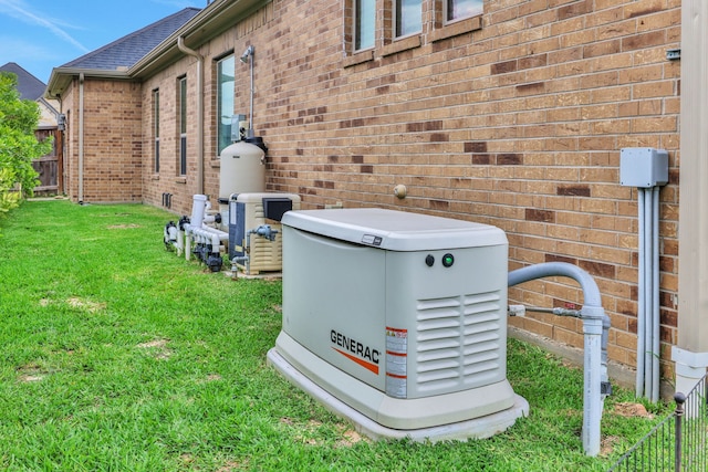 details with fence, a power unit, and brick siding
