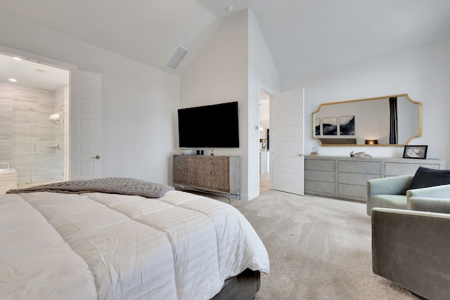 bedroom featuring light colored carpet, connected bathroom, lofted ceiling, and visible vents