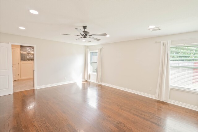 unfurnished room featuring recessed lighting, ceiling fan, visible vents, and baseboards