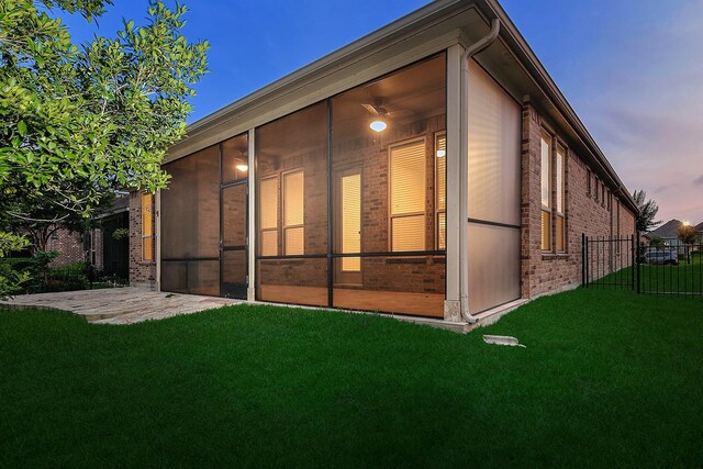 249 Palomino Ct, The Woodlands, TX 77382 - rear view of house featuring a sunroom and brick siding