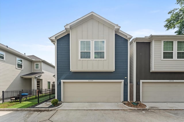 view of front of property with fence, board and batten siding, concrete driveway, and a garage