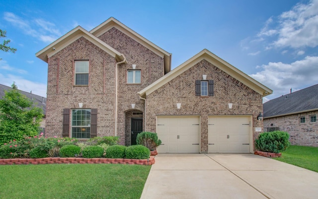 7610 River Pass Dr, Pearland, TX 77581 - traditional home with brick siding, an attached garage, driveway, and a front yard