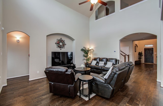 7610 River Pass Dr, Pearland, TX 77581 - living area with dark wood-type flooring, a ceiling fan, arched walkways, and high vaulted ceiling