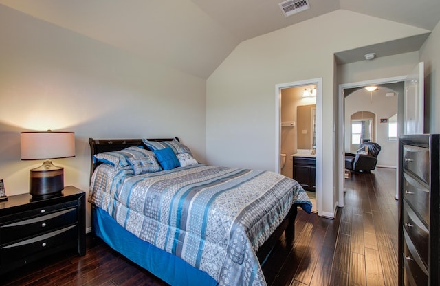 7610 River Pass Dr, Pearland, TX 77581 - bedroom featuring vaulted ceiling, dark wood finished floors, connected bathroom, and visible vents