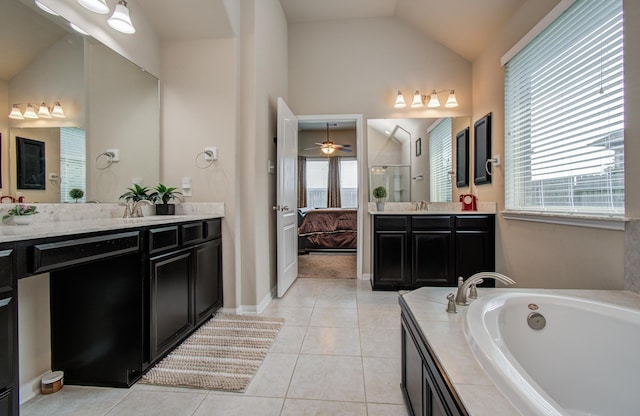 7610 River Pass Dr, Pearland, TX 77581 - bathroom with a bath, two vanities, tile patterned floors, lofted ceiling, and tiled shower
