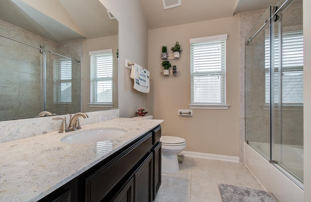 7610 River Pass Dr, Pearland, TX 77581 - bathroom featuring baseboards, visible vents, a healthy amount of sunlight, and tile patterned flooring
