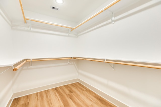 walk in closet featuring light wood-style floors and visible vents