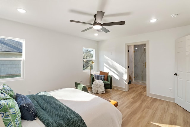 bedroom featuring connected bathroom, ceiling fan, light wood-style flooring, recessed lighting, and baseboards